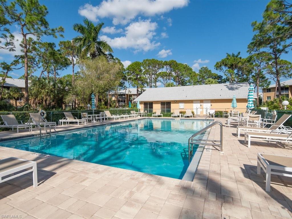 3012 Sandpiper Bay Circle, Unit D301 Naples, FL 34112 - Photo 20 of 23 a view of a house with yard and a patio