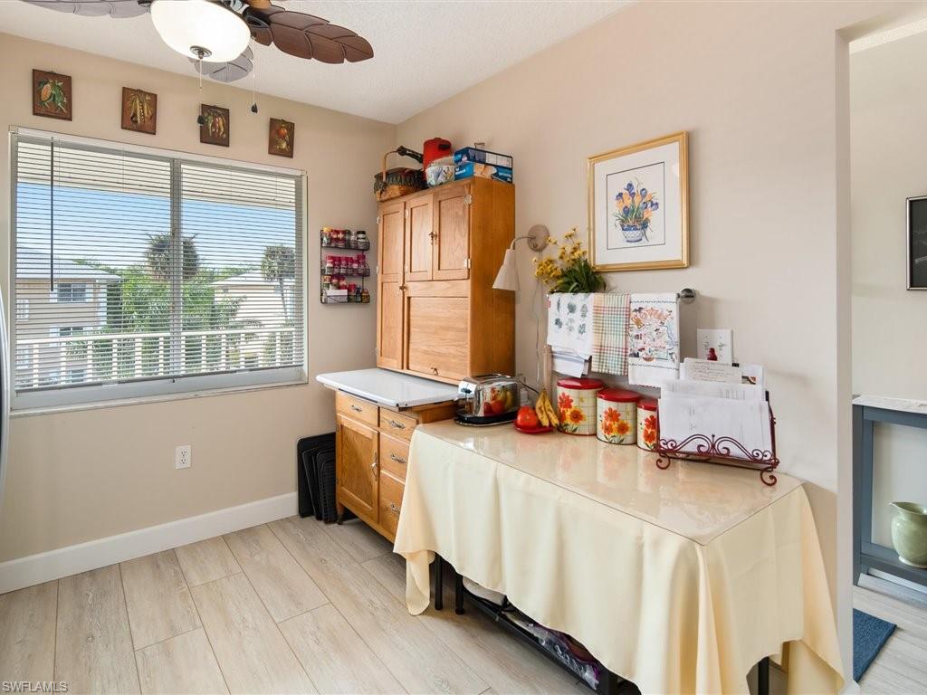 3012 Sandpiper Bay Circle, Unit D301 Naples, FL 34112 - Photo 9 of 23 a bedroom with furniture and a window