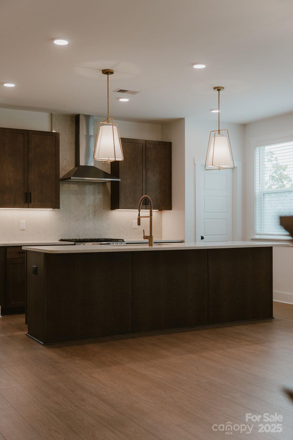 817 Garringer Place Charlotte, NC 28208 - Photo 12 of 33 a kitchen with stainless steel appliances granite countertop a sink a counter space and cabinets