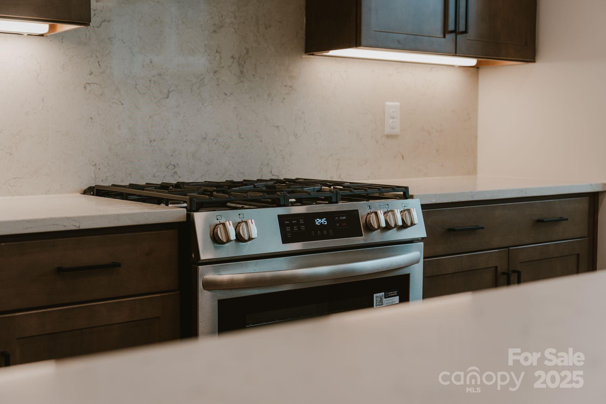 817 Garringer Place Charlotte, NC 28208 - Photo 13 of 33 a stove top oven sitting inside of a kitchen