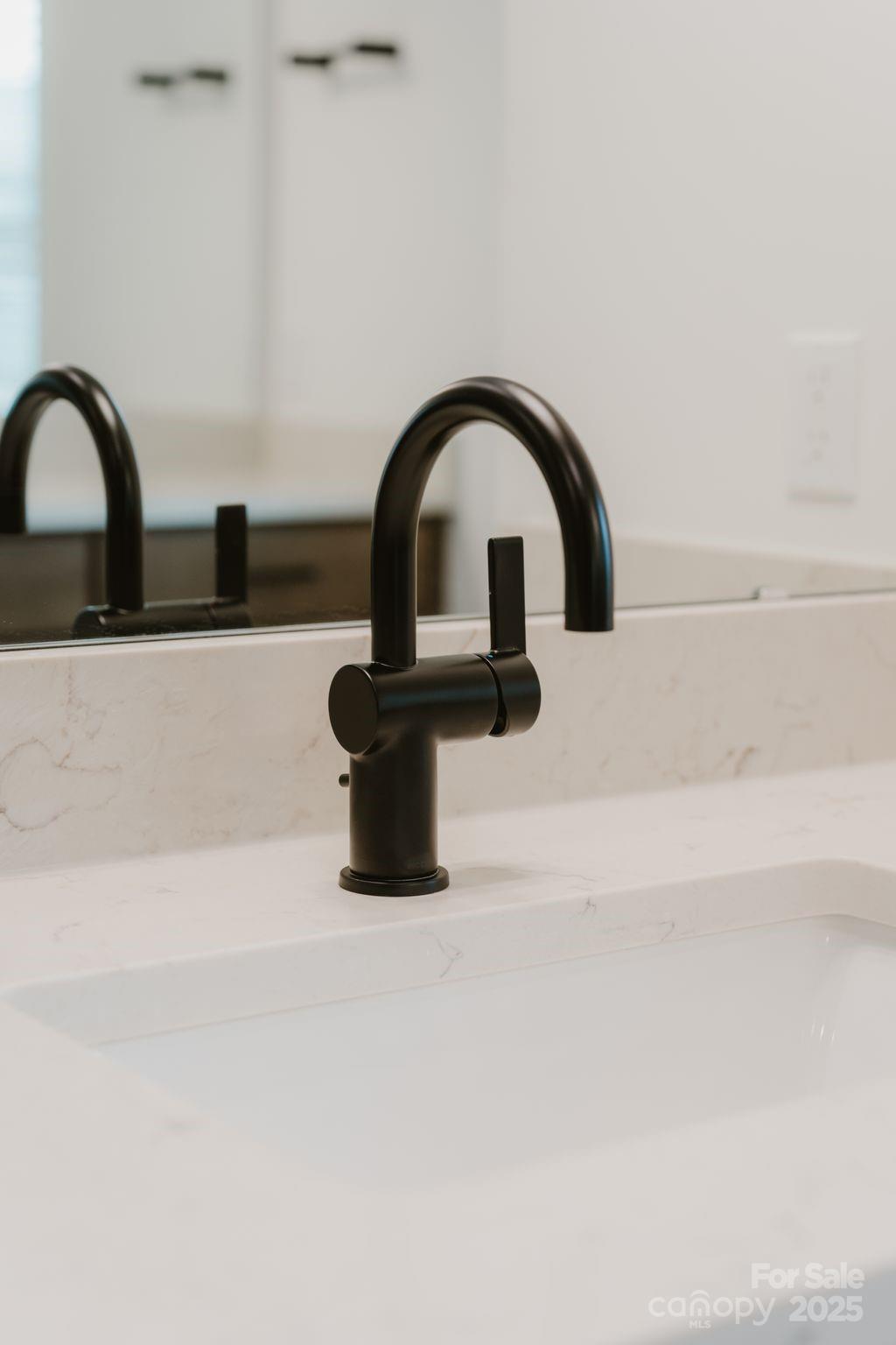 817 Garringer Place Charlotte, NC 28208 - Photo 18 of 33 a close view of a faucet a sink and a tap