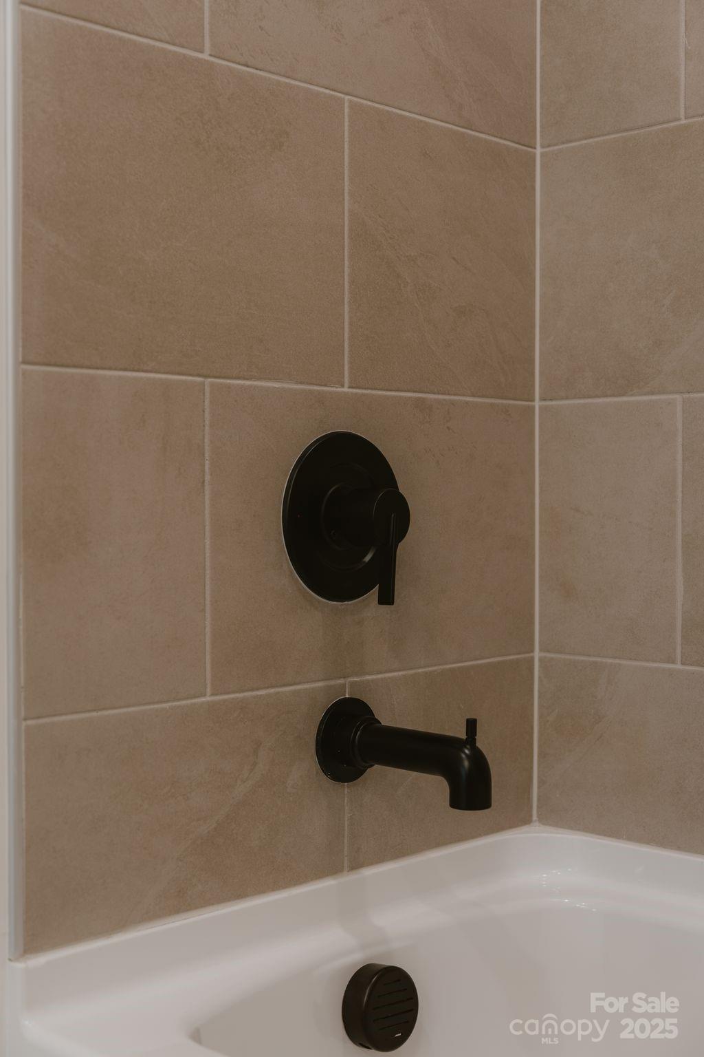 817 Garringer Place Charlotte, NC 28208 - Photo 20 of 33 a bathroom with a shower