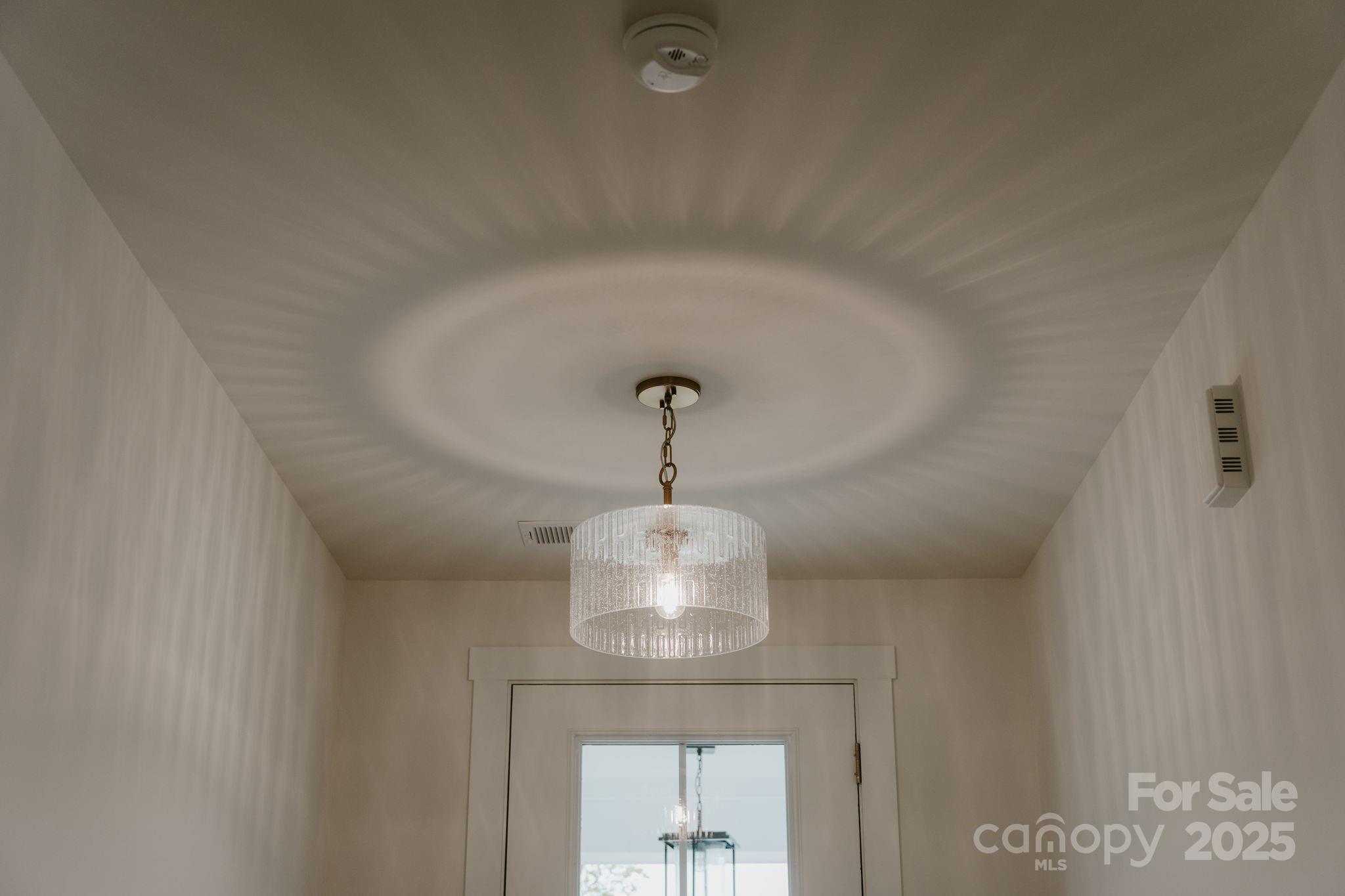 817 Garringer Place Charlotte, NC 28208 - Photo 22 of 33 a view of a hallway with a chandelier
