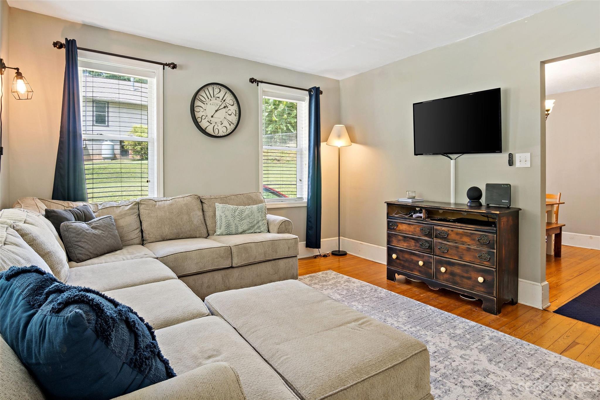 134 Spring Street Old Fort, NC 28762 - Photo 11 of 34 a living room with furniture and a flat screen tv