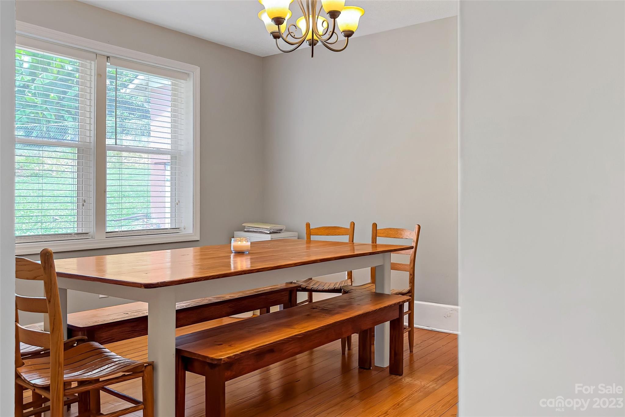 134 Spring Street Old Fort, NC 28762 - Photo 13 of 34 a view of a dining room with furniture and wooden floor