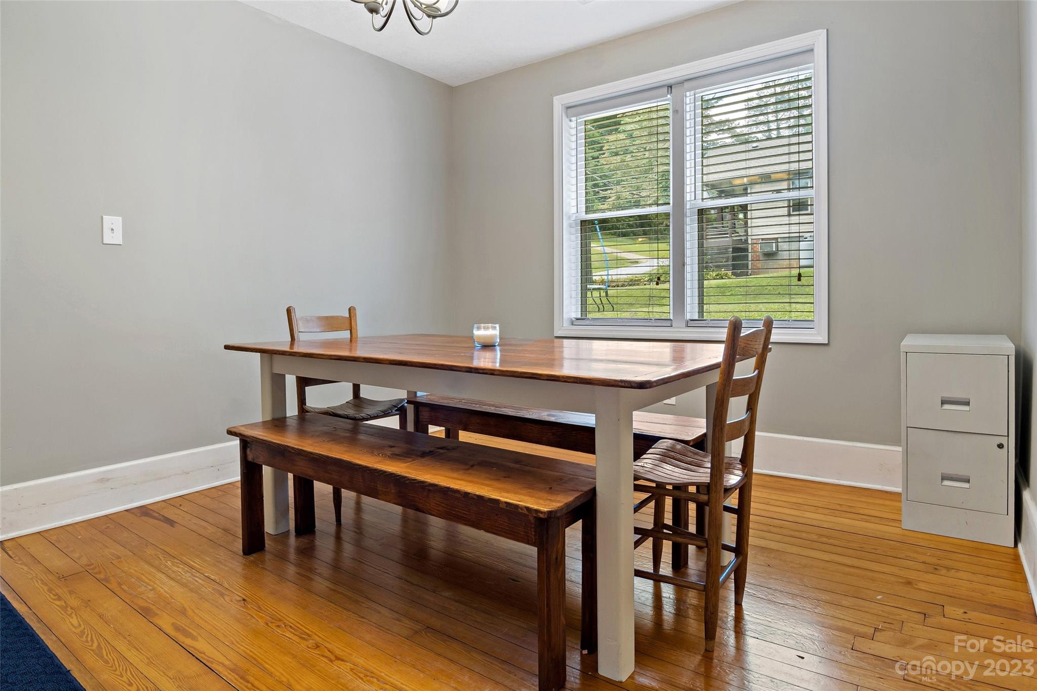 134 Spring Street Old Fort, NC 28762 - Photo 14 of 34 a view of a dining room with furniture and wooden floor
