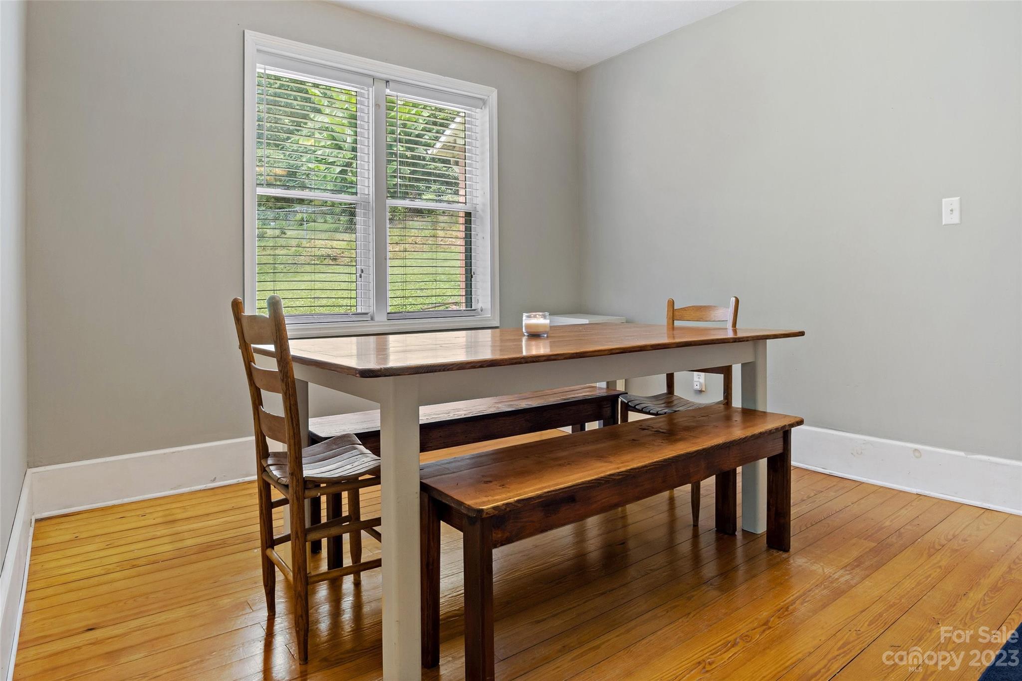 134 Spring Street Old Fort, NC 28762 - Photo 15 of 34 a view of a dining room with furniture and wooden floor