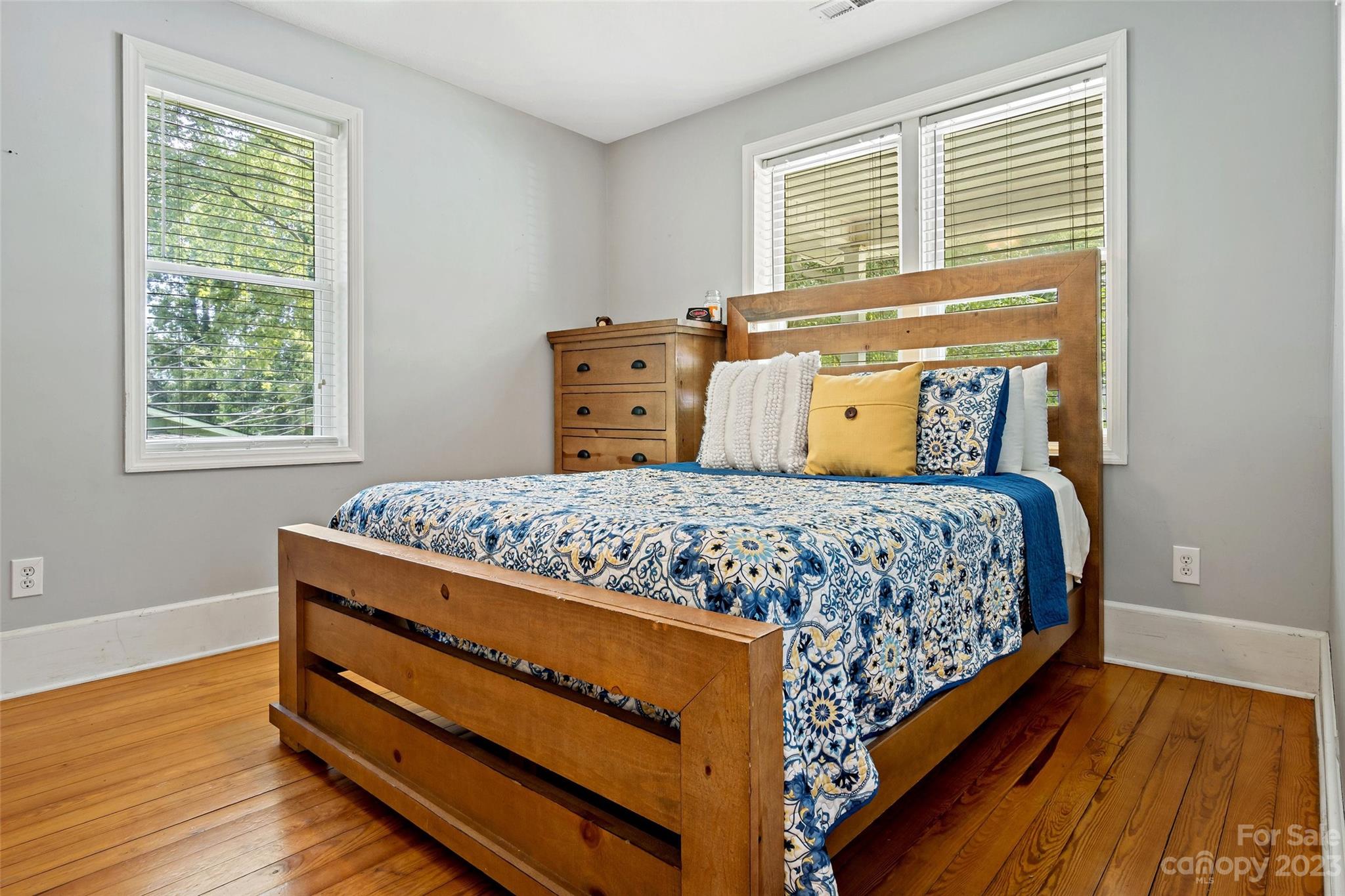 134 Spring Street Old Fort, NC 28762 - Photo 22 of 34 a bedroom with a bed and wooden floor
