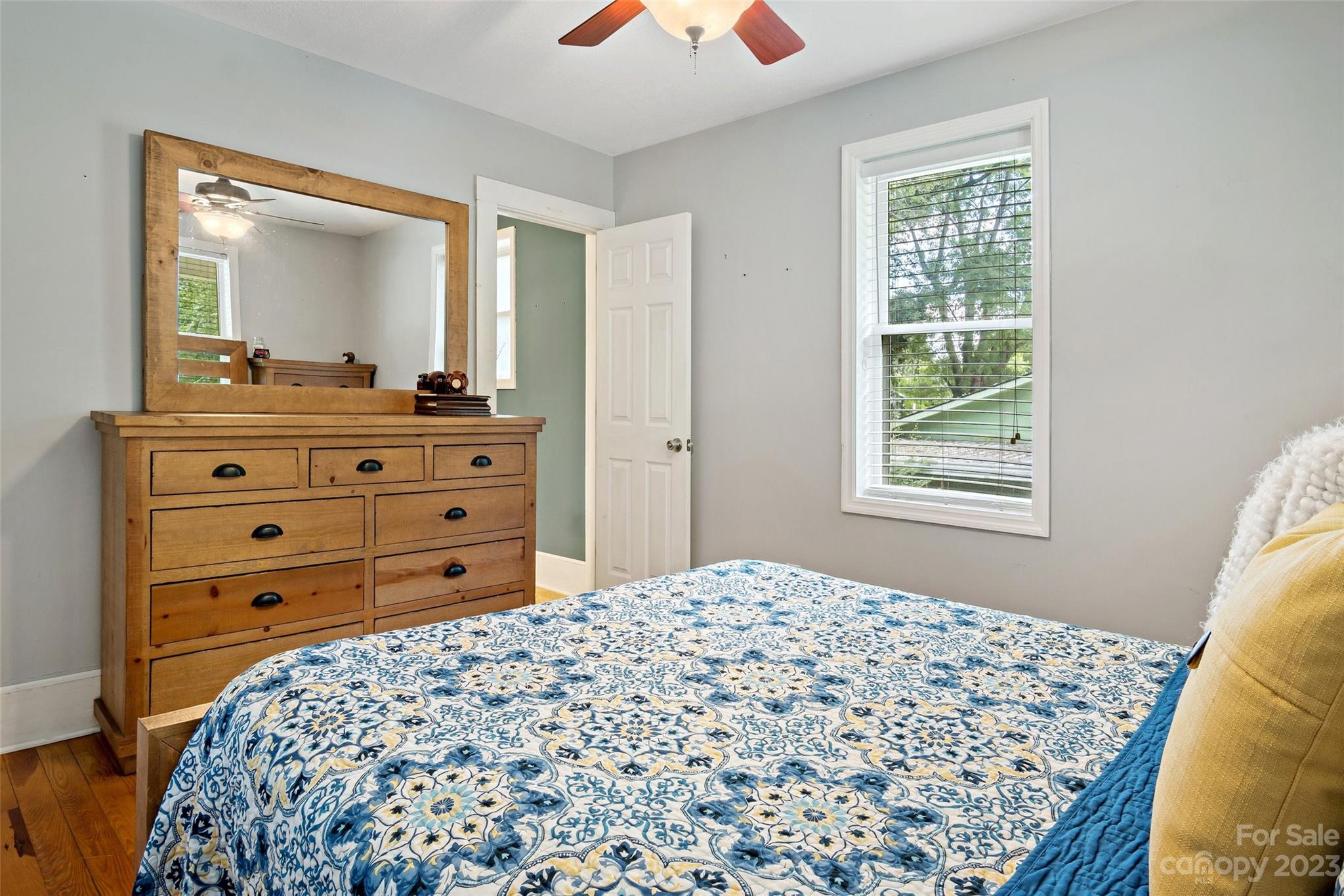 134 Spring Street Old Fort, NC 28762 - Photo 23 of 34 a bedroom with a bed and a dresser