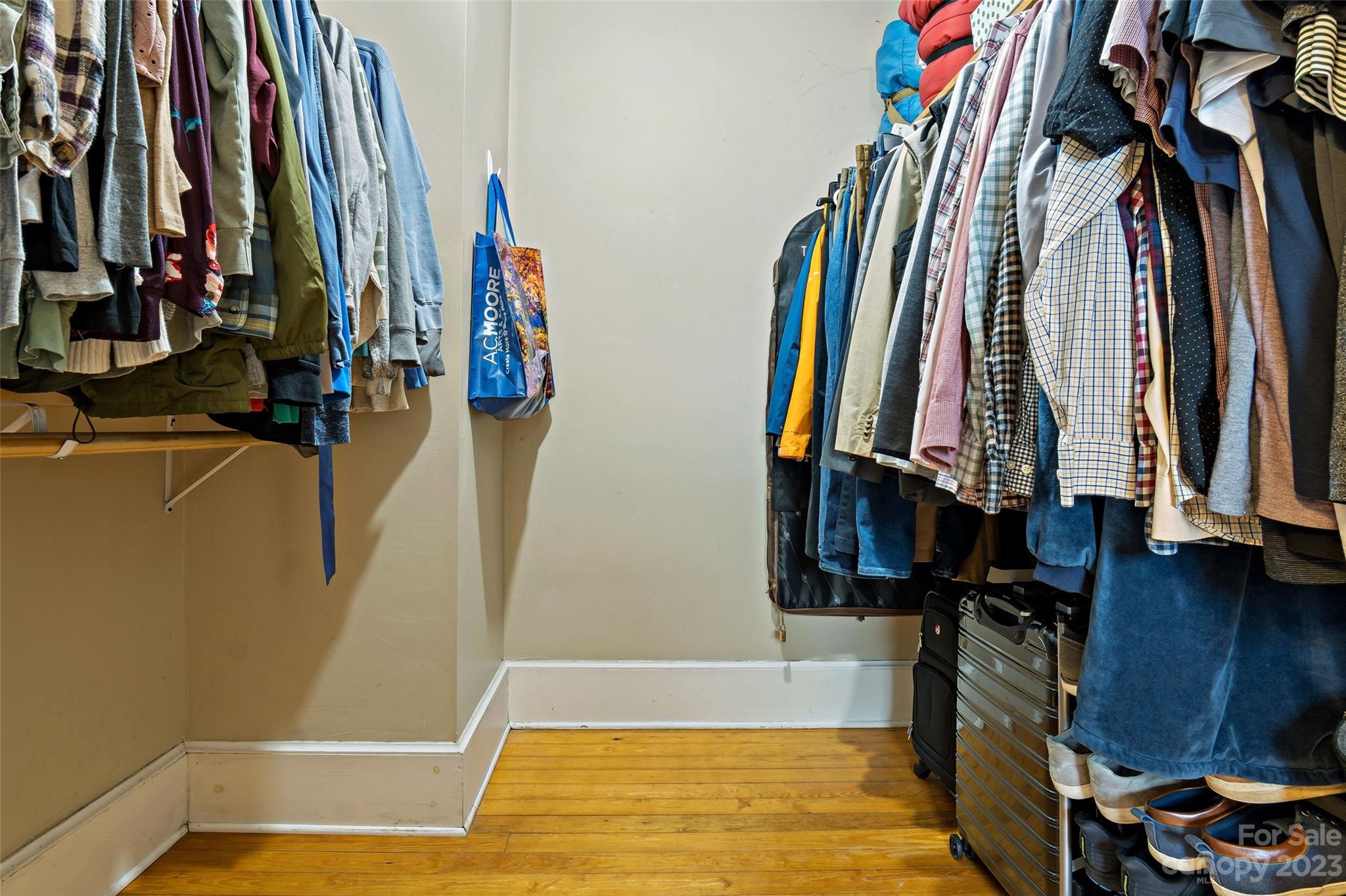 134 Spring Street Old Fort, NC 28762 - Photo 27 of 34 a view of walk in closet with clothes and shoes
