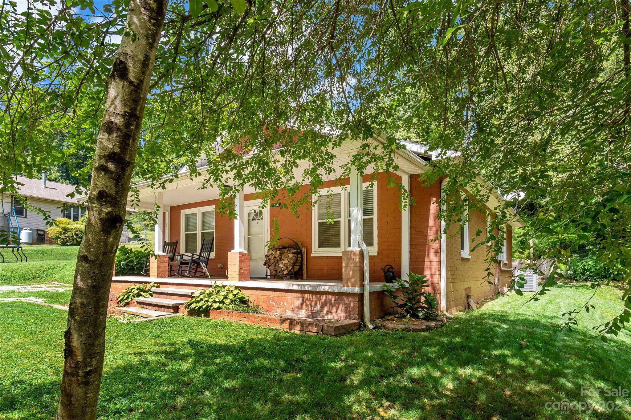 134 Spring Street Old Fort, NC 28762 - Photo 3 of 34 a front view of house with yard and green space