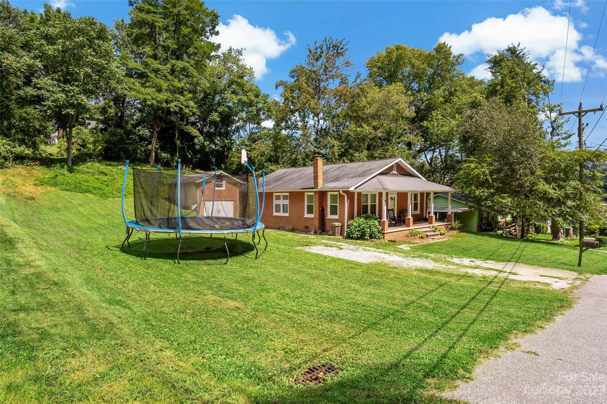 134 Spring Street Old Fort, NC 28762 - Photo 4 of 34 a view of a house with a yard