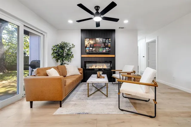 a living room with furniture and a large window
