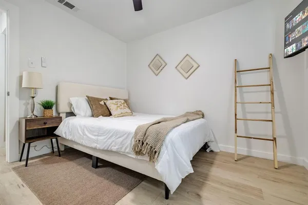 a bedroom with a bed and a window