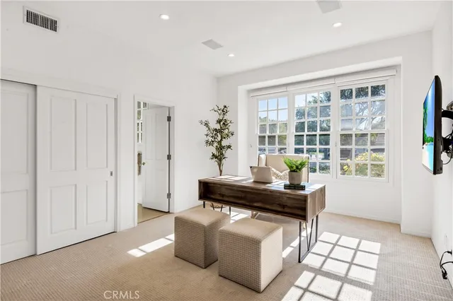 a room with furniture and a flat screen tv