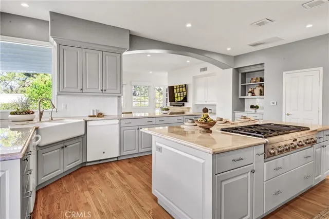 a kitchen with a stove a sink and a refrigerator