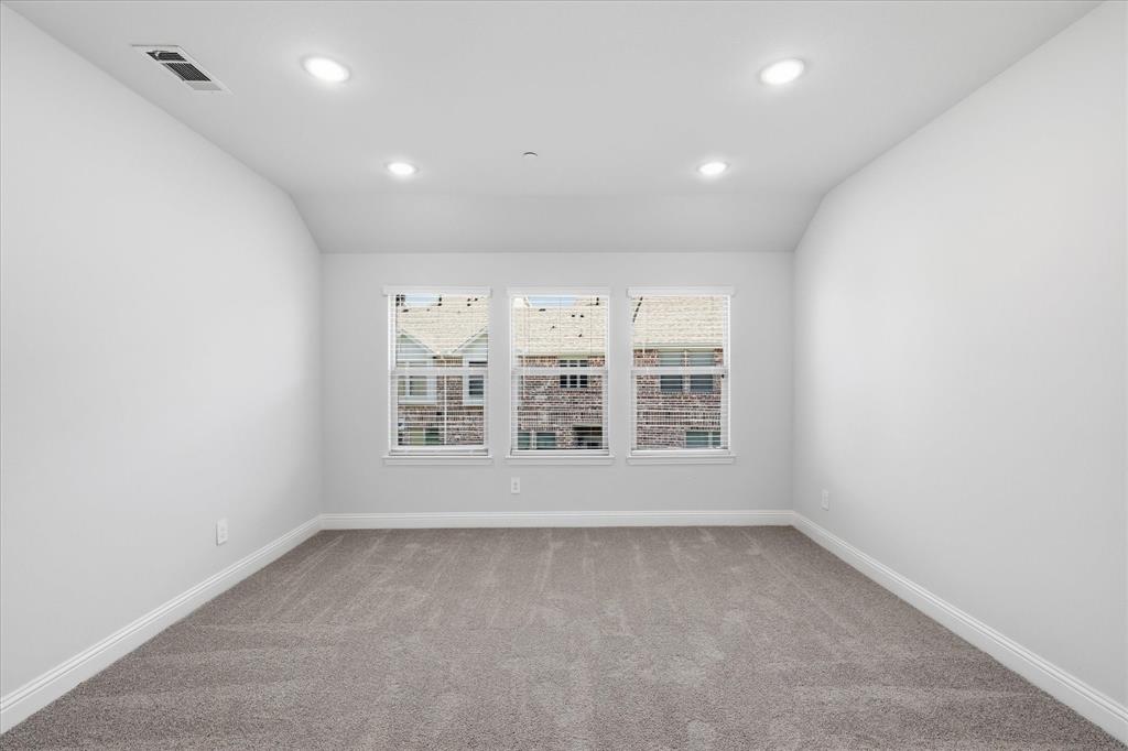 519 Sequoia Street Allen, TX 75002 - Photo 28 of 38 Interior room featuring three windows with blinds, recessed lighting, gray carpeting, white baseboards, and neutral wall tones