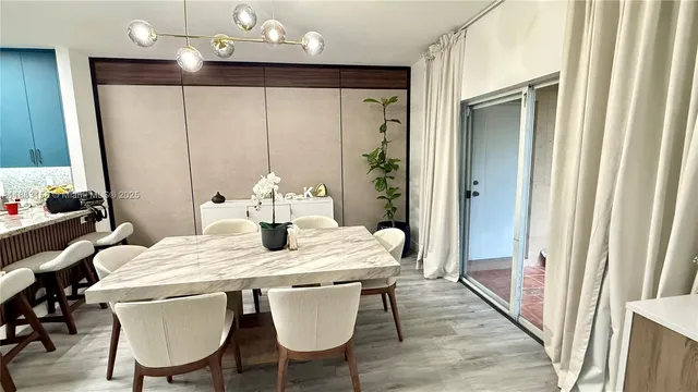 a large kitchen with a table and chairs