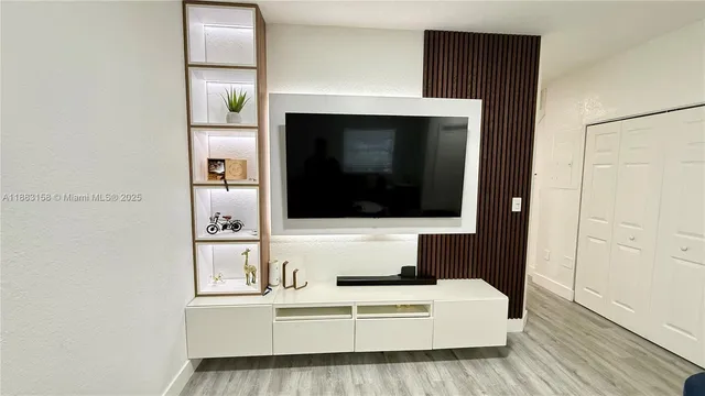 a living room with a couch and a flat screen tv