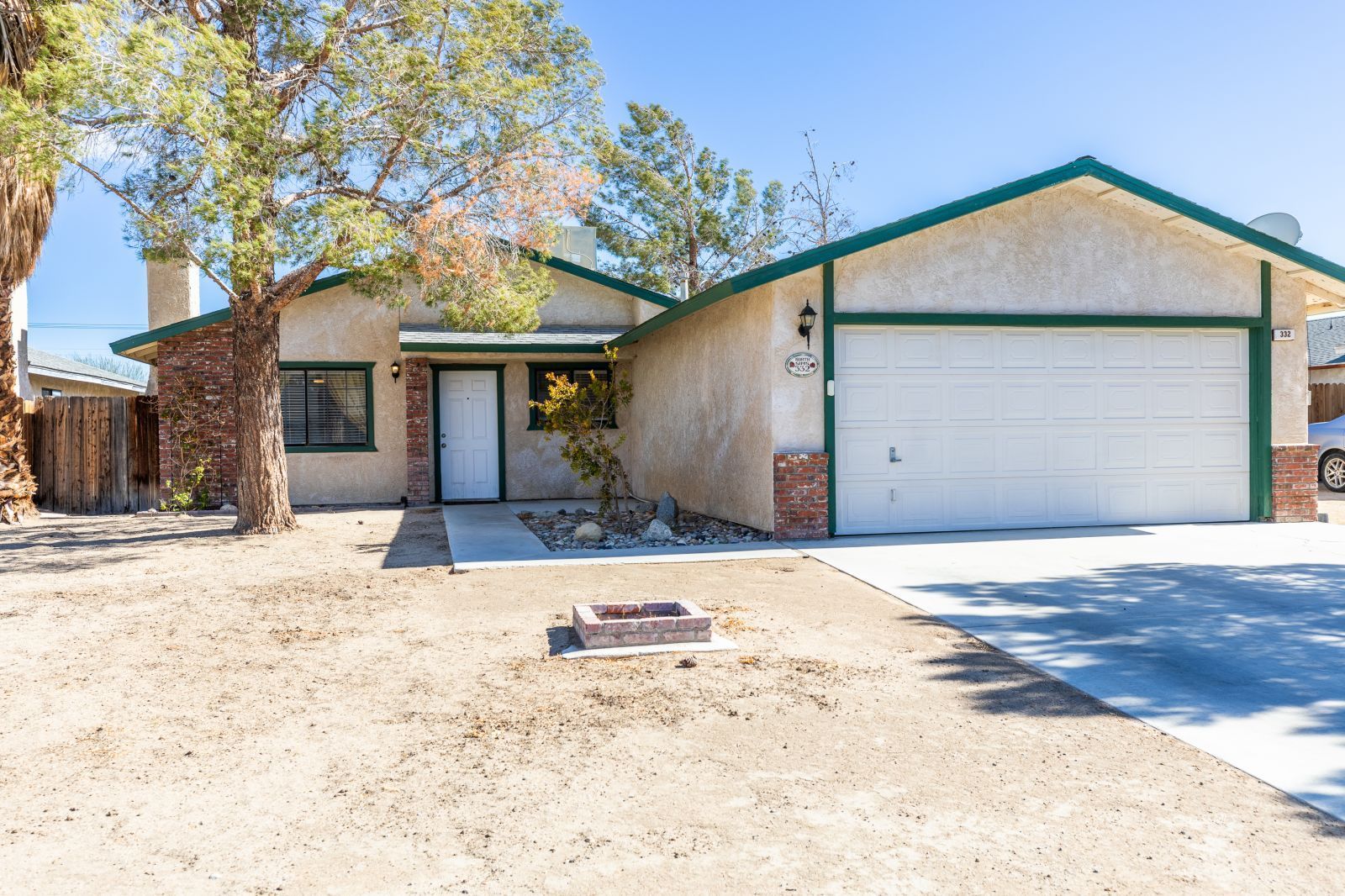 332 Sims Street Ridgecrest, CA 93555 - Photo 1 of 29 a front view of a house with a yard