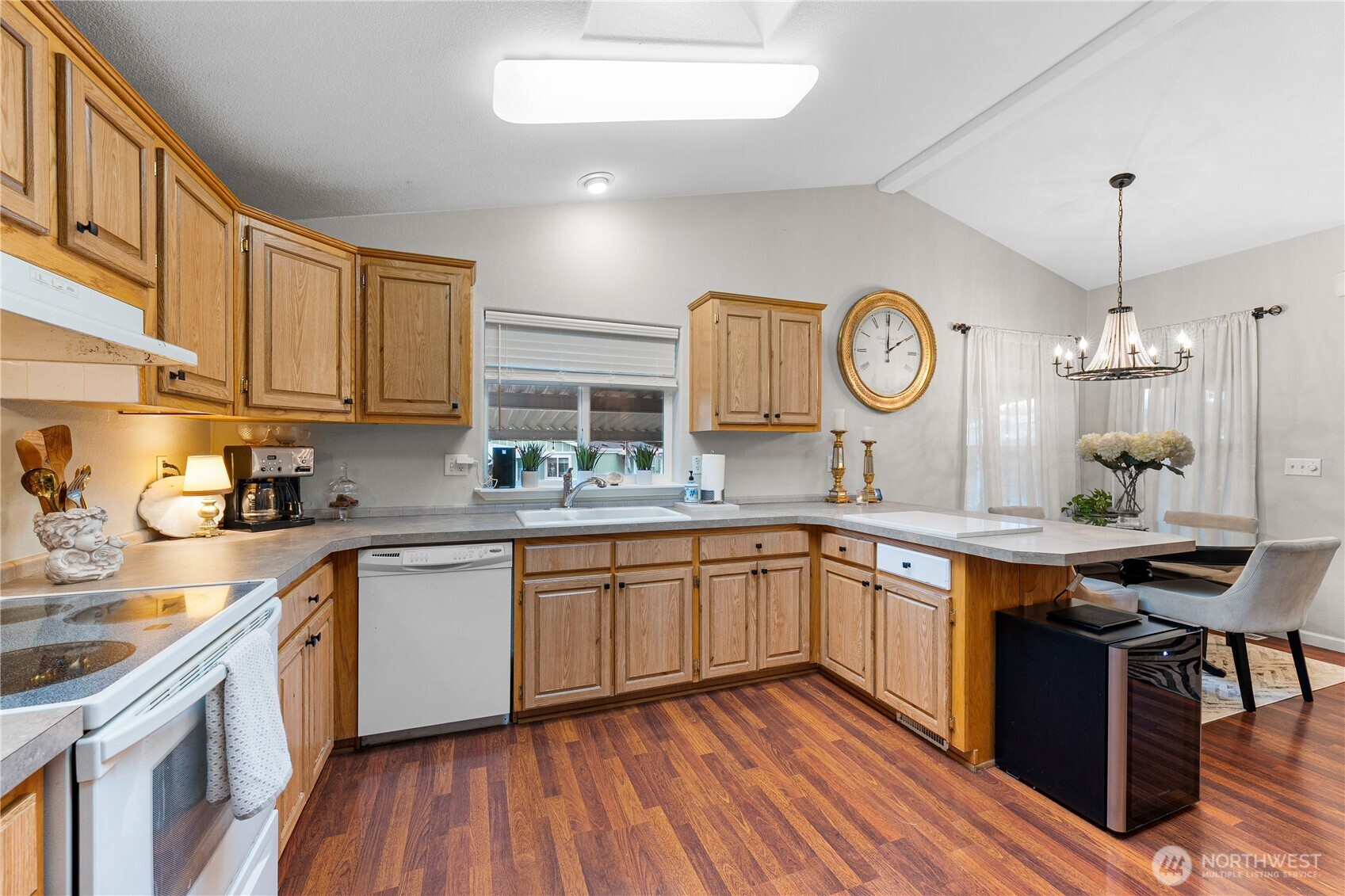 23825 15th Avenue Southeast, Unit 40 Bothell, WA 98021 - Photo 13 of 39 a kitchen with stainless steel appliances granite countertop wooden cabinets and sink