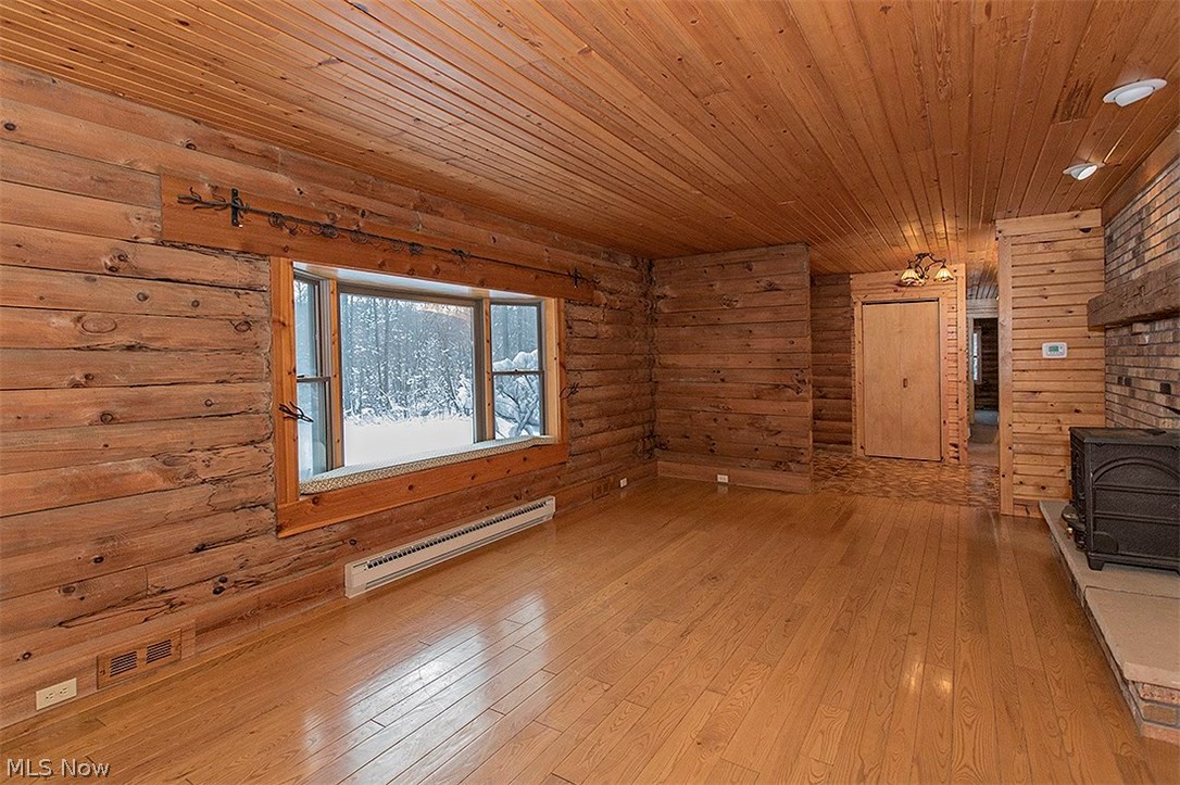 11575 Colburn Road Painesville, OH 44077 - Photo 17 of 23 Large windows overlook the wooded view.