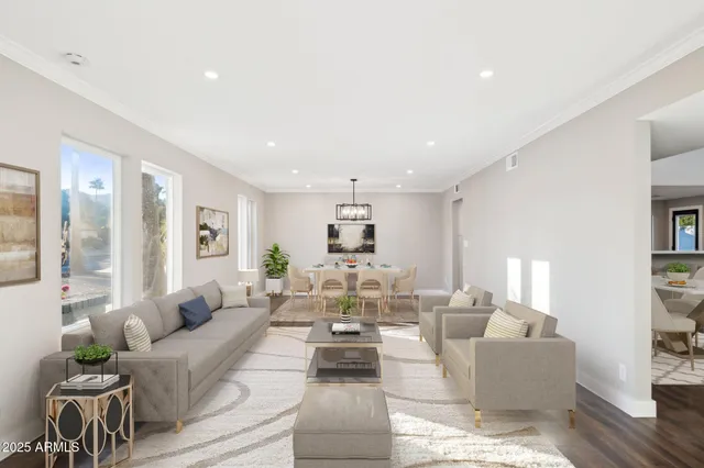 a living room with fireplace furniture and a wooden floor