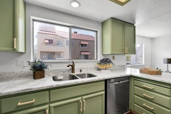 a kitchen with sink and window