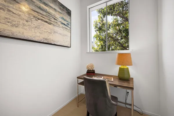 a workspace with furniture and a window