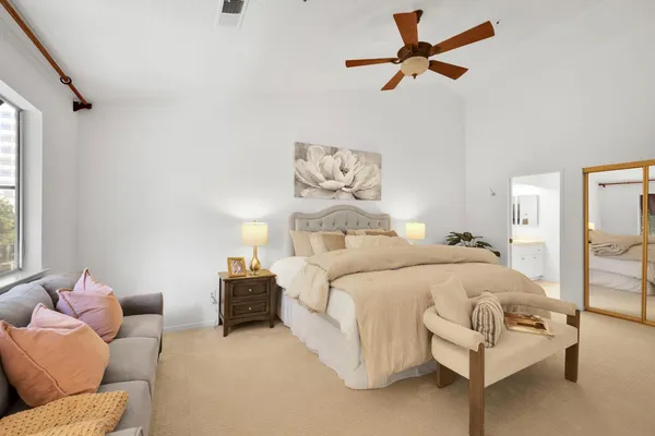 a bedroom with a bed and window