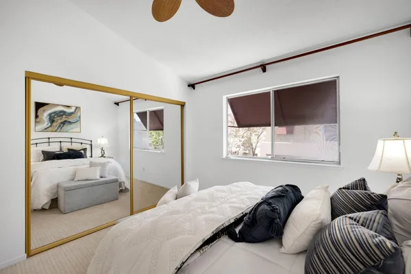 a bedroom with bed and window