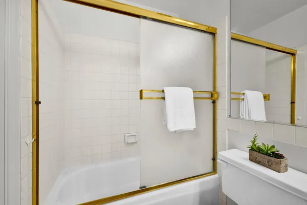 a bathroom with a bathtub and a shower