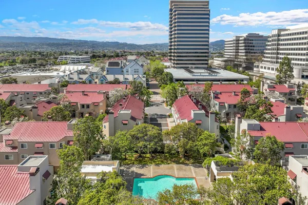 an aerial view of residential houses with outdoor space