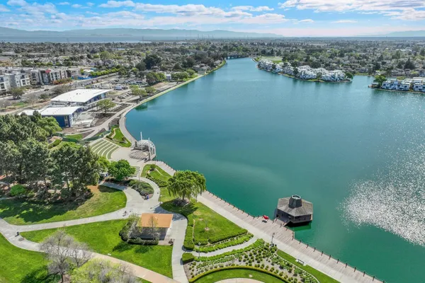 an aerial view of a house with a lake view