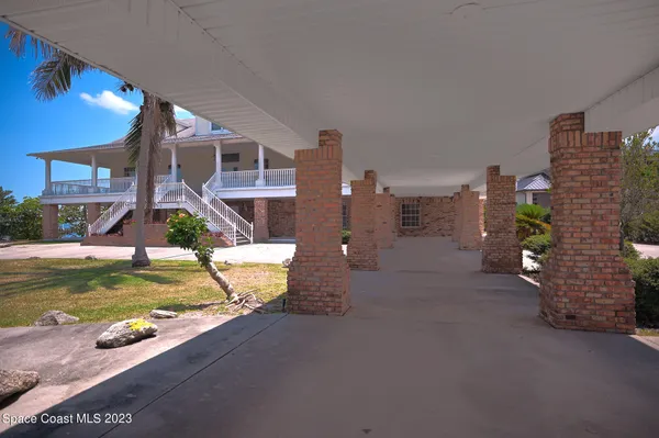 a view of a building with porch and outdoor space