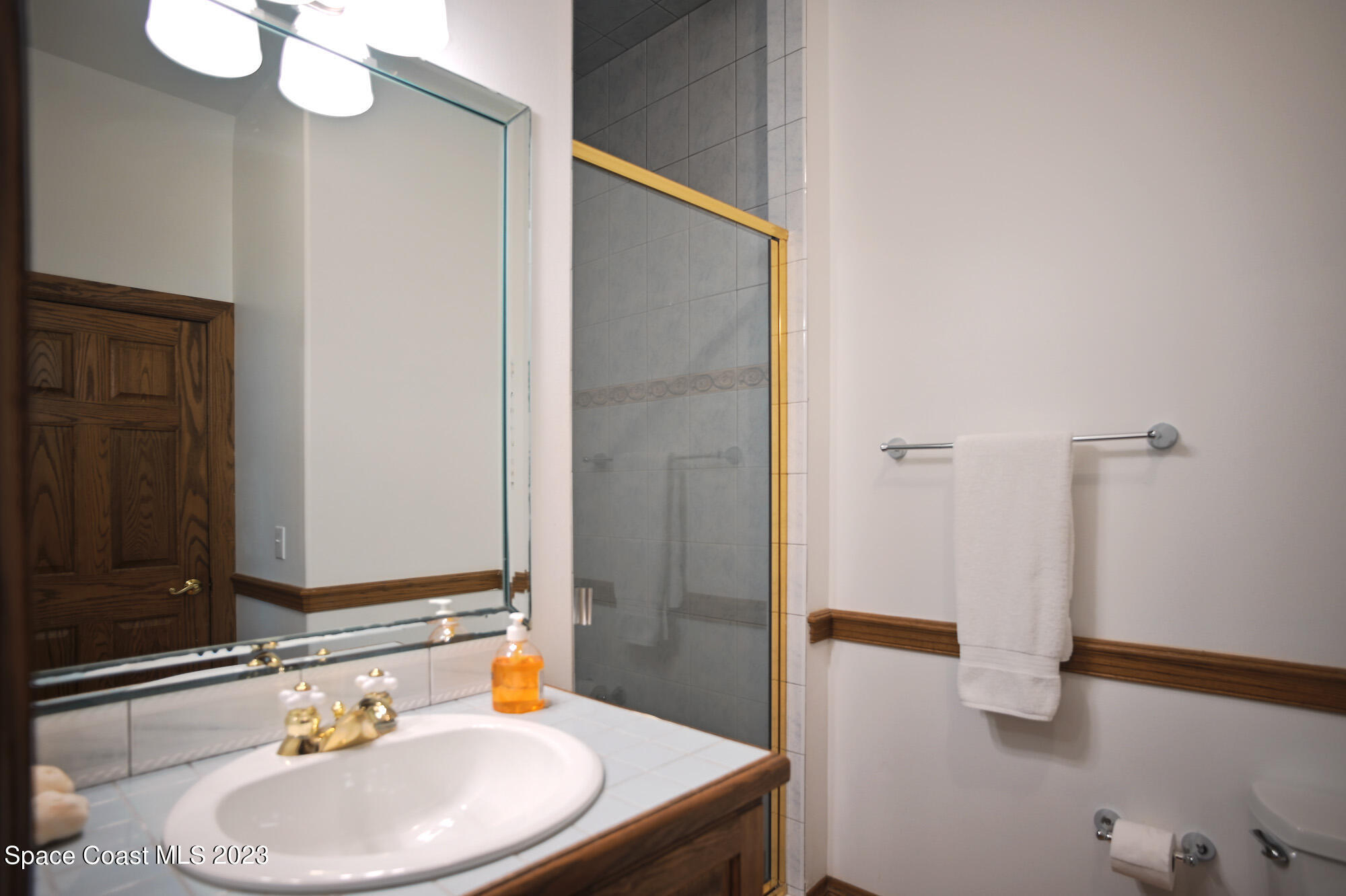 6285 N Highway Melbourne, FL 32940 - Photo 32 of 58 a bathroom with a sink a toilet and shower