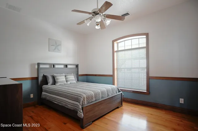 a bedroom with a bed and a table