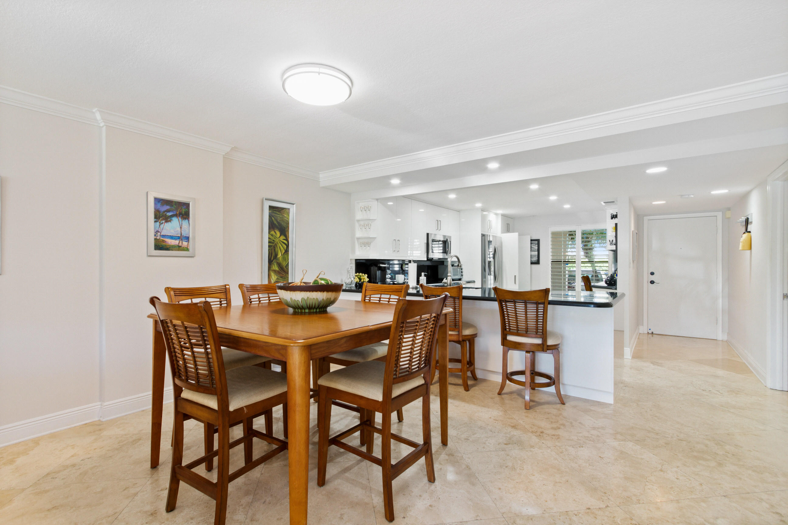 1631 Riverview Road, Unit 102 Deerfield Beach, FL 33441 - Photo 11 of 37 a view of a dining area with furniture