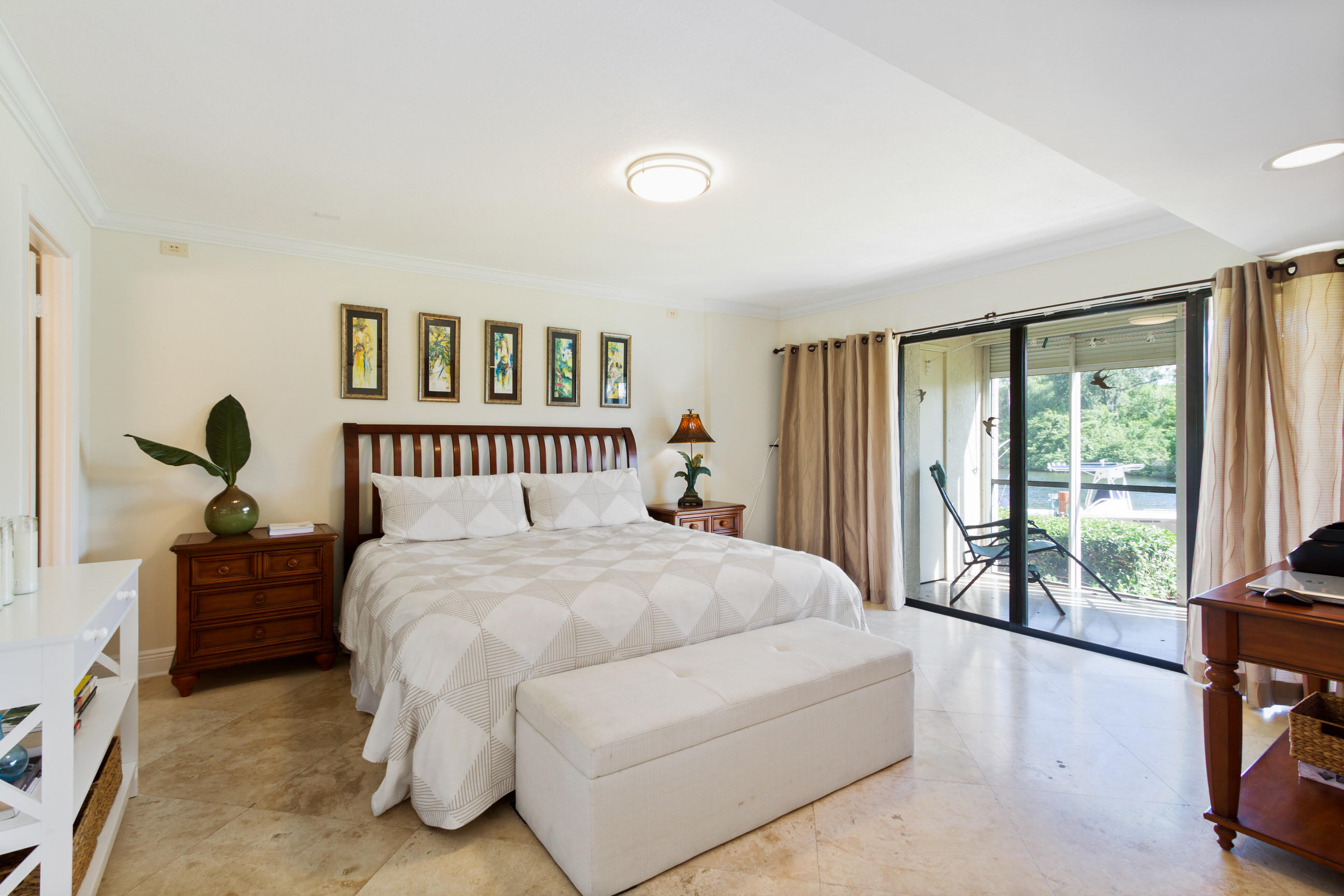1631 Riverview Road, Unit 102 Deerfield Beach, FL 33441 - Photo 15 of 37 a spacious bedroom with a bed and a large window