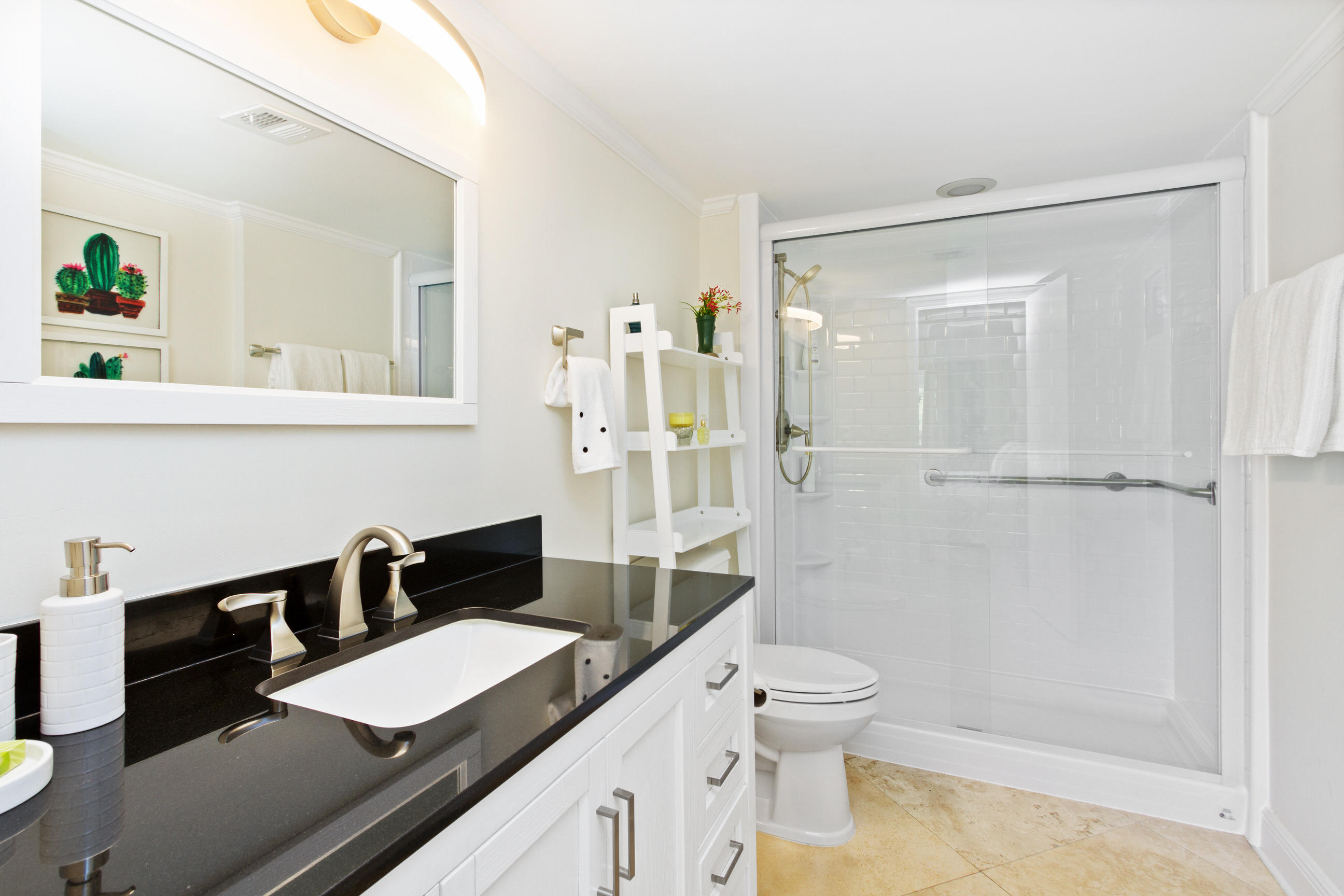 1631 Riverview Road, Unit 102 Deerfield Beach, FL 33441 - Photo 16 of 37 a bathroom with a granite countertop sink and a mirror