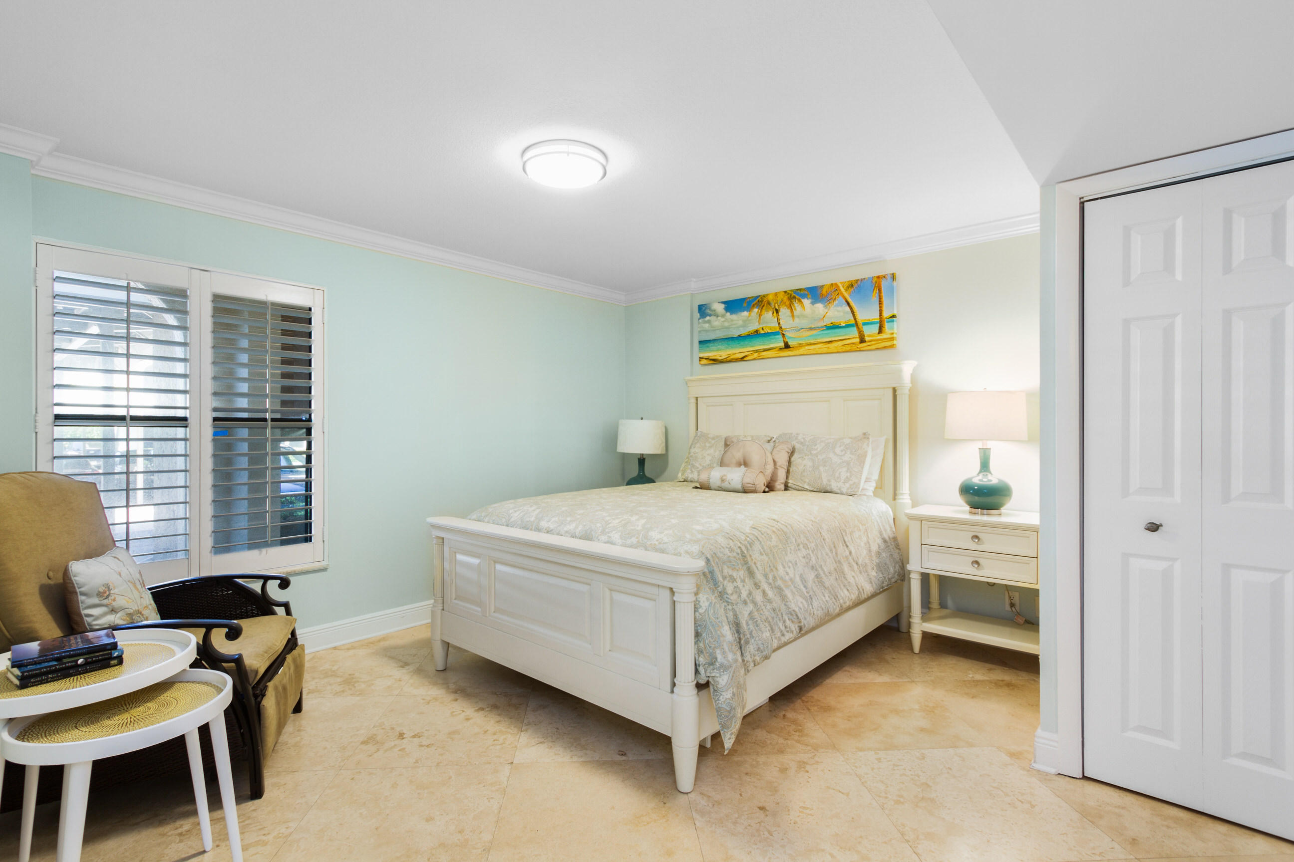 1631 Riverview Road, Unit 102 Deerfield Beach, FL 33441 - Photo 17 of 37 a bedroom with a bed and a desk