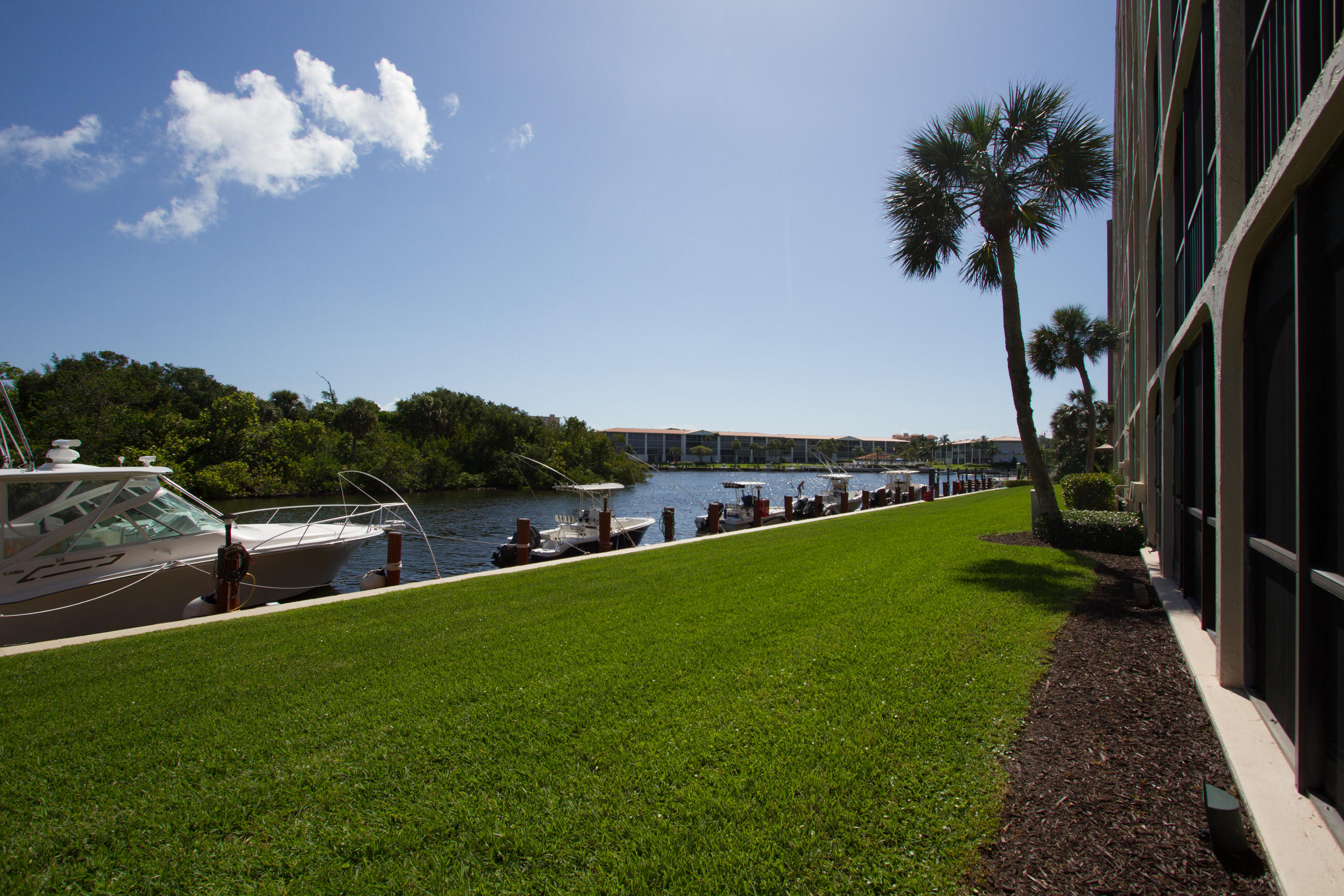 1631 Riverview Road, Unit 102 Deerfield Beach, FL 33441 - Photo 21 of 37 a view of a swimming pool with a yard
