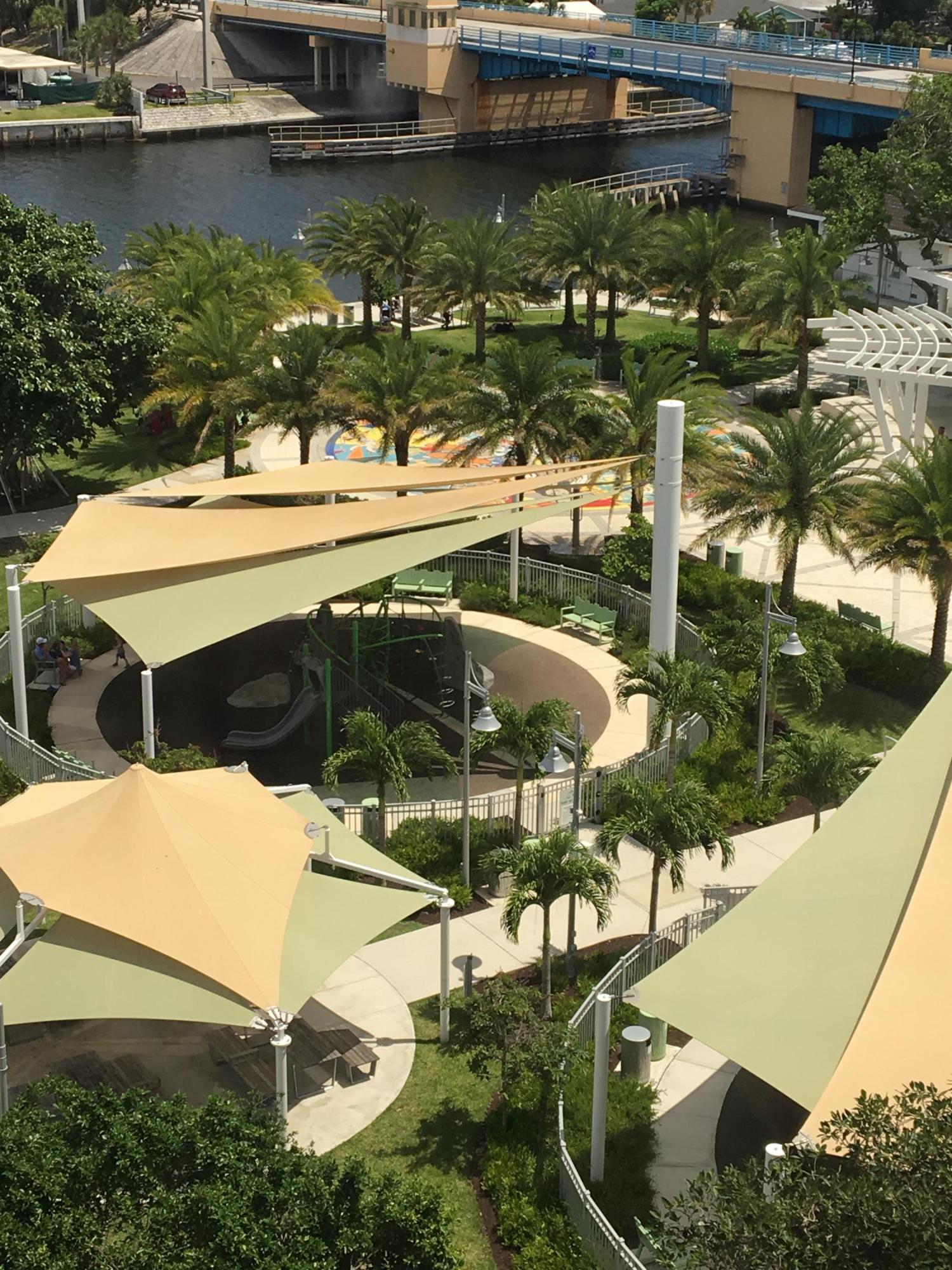 1631 Riverview Road, Unit 102 Deerfield Beach, FL 33441 - Photo 24 of 37 a backyard of a house with lake view and boat