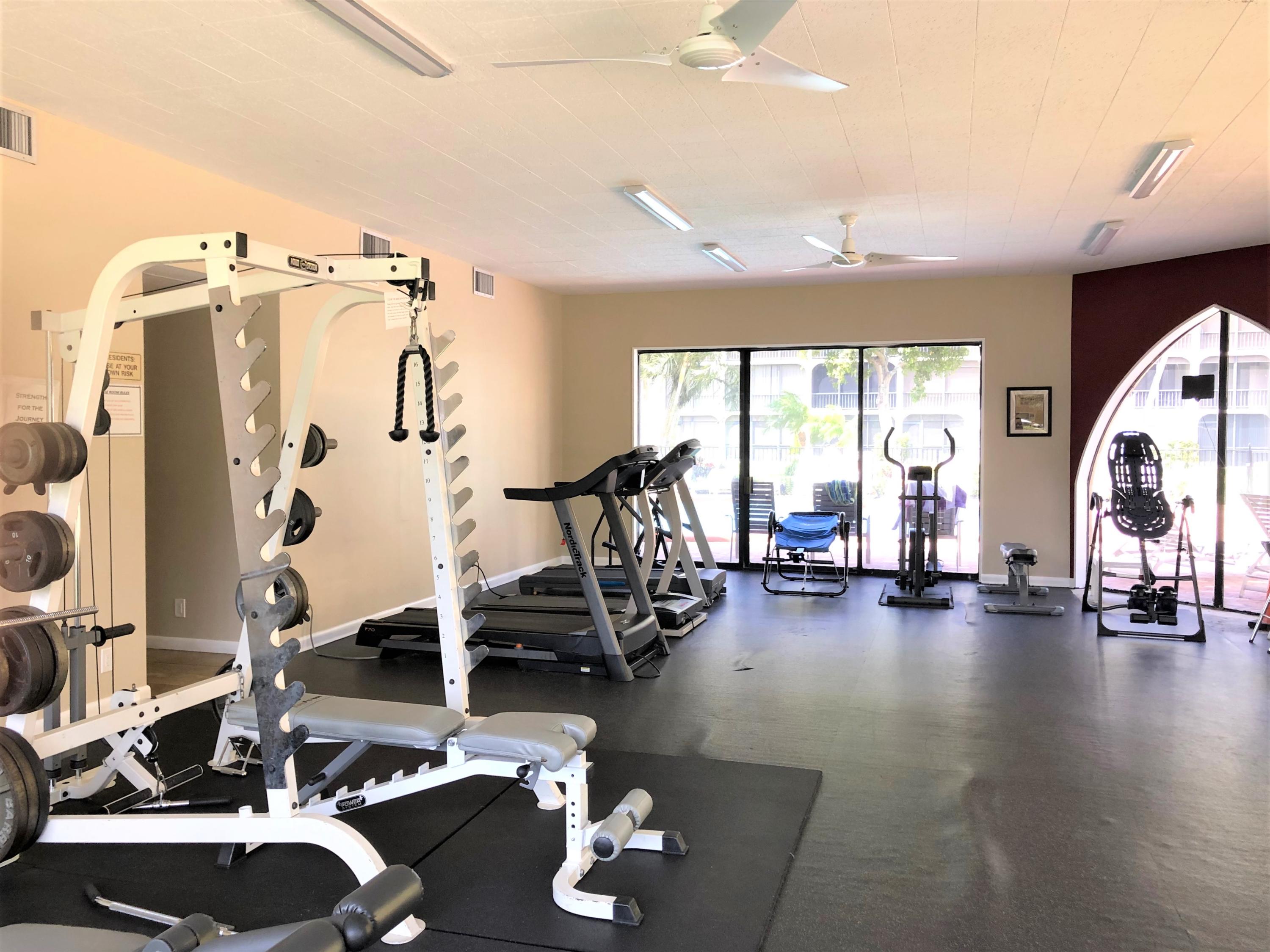 1631 Riverview Road, Unit 102 Deerfield Beach, FL 33441 - Photo 27 of 37 a view of a room with gym equipment