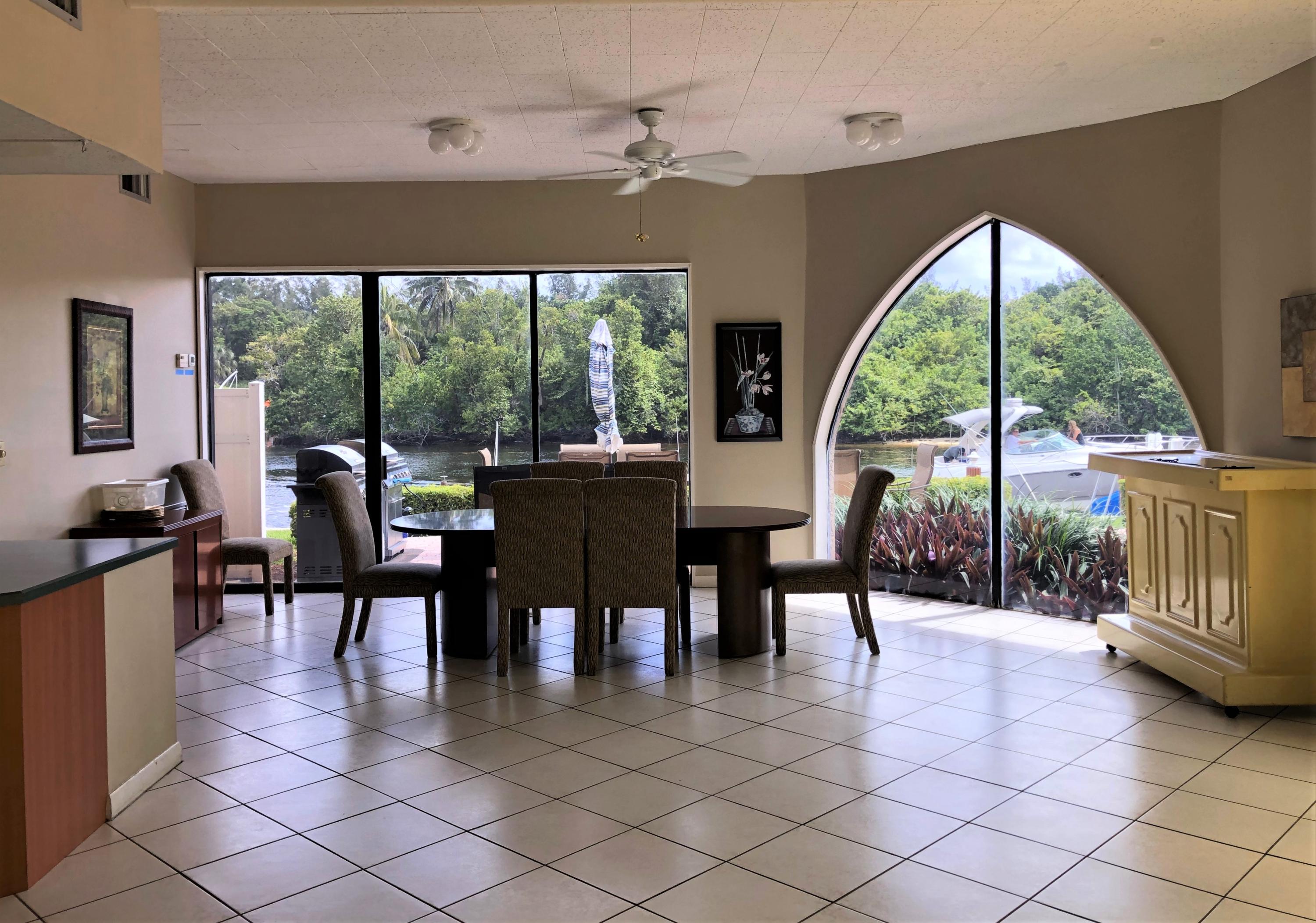 1631 Riverview Road, Unit 102 Deerfield Beach, FL 33441 - Photo 29 of 37 a view of a dining room with furniture window and outside view