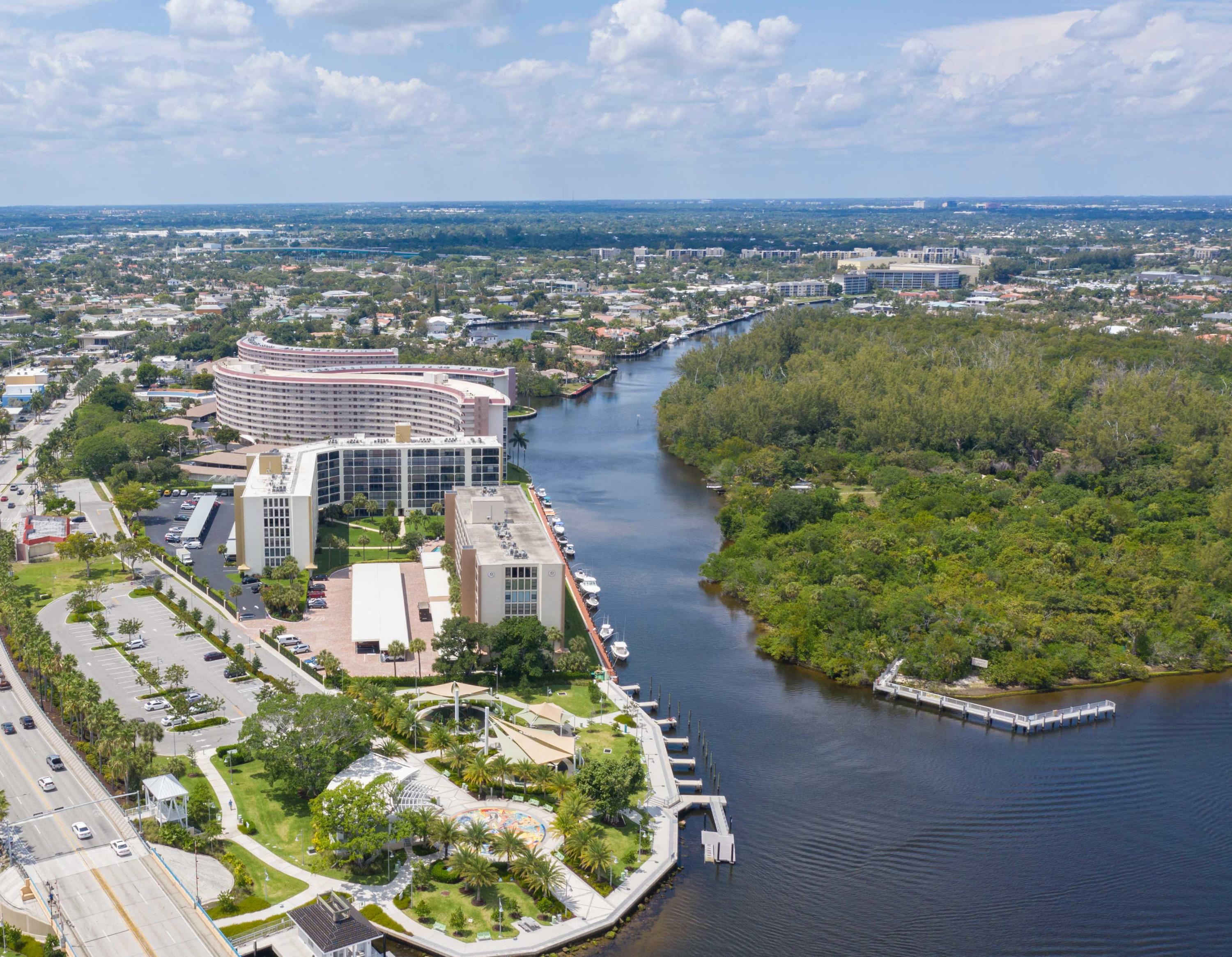 1631 Riverview Road, Unit 102 Deerfield Beach, FL 33441 - Photo 33 of 37 an aerial view of a house with a garden and lake view