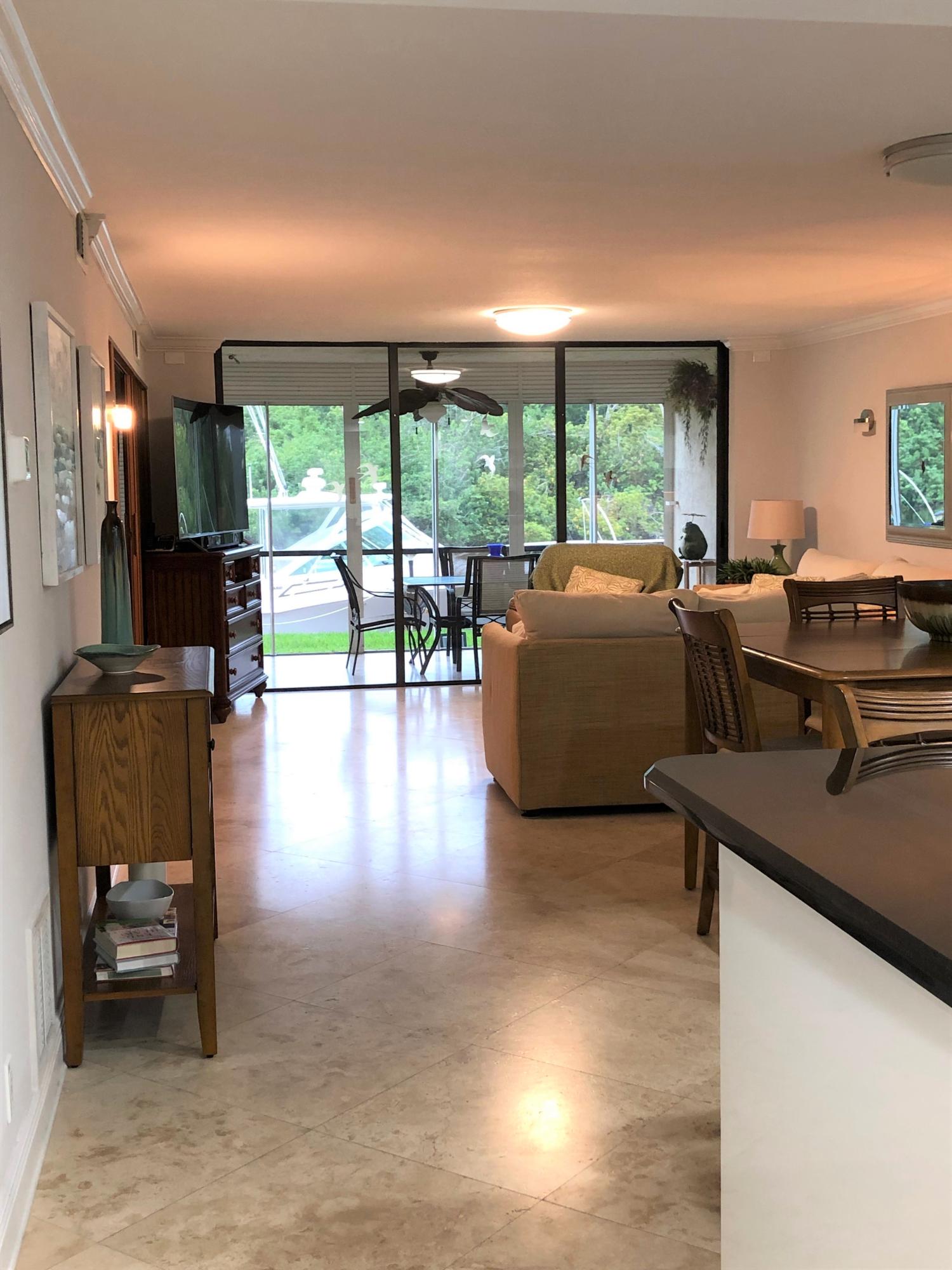 1631 Riverview Road, Unit 102 Deerfield Beach, FL 33441 - Photo 37 of 37 a living room with furniture and a flat screen tv