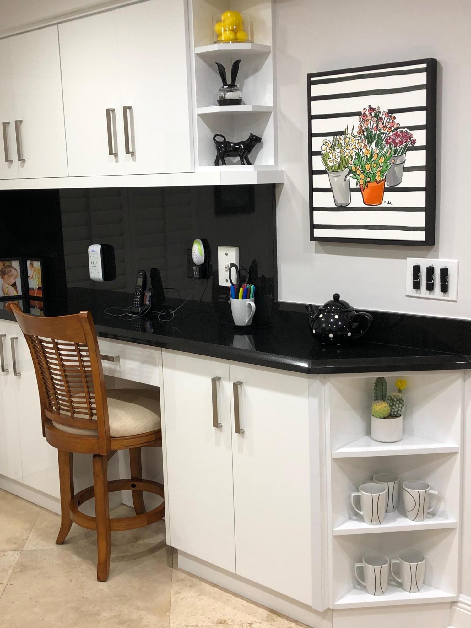 1631 Riverview Road, Unit 102 Deerfield Beach, FL 33441 - Photo 7 of 37 a kitchen with a stove and a cabinet