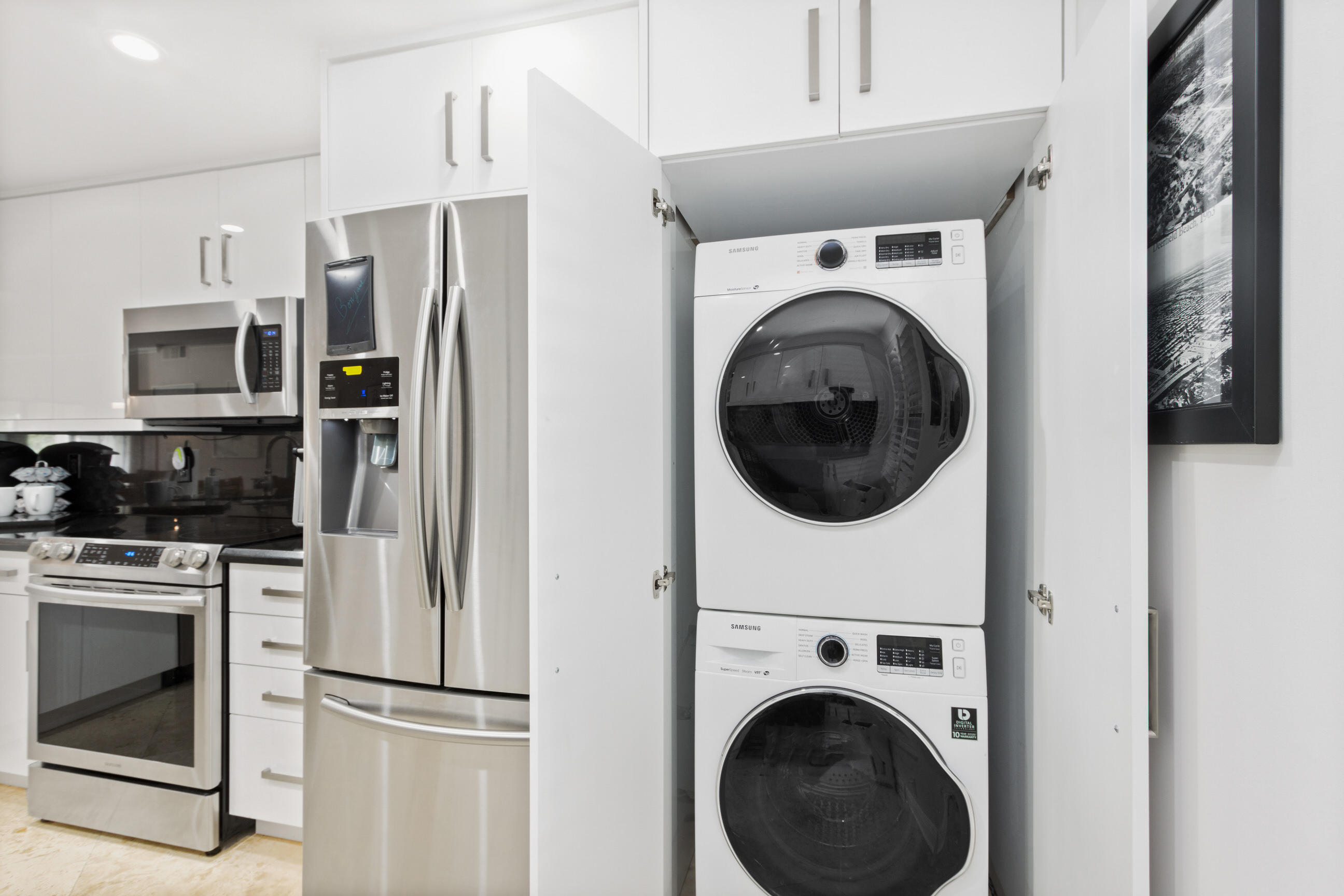 1631 Riverview Road, Unit 102 Deerfield Beach, FL 33441 - Photo 9 of 37 a view of a kitchen with washer and dryer