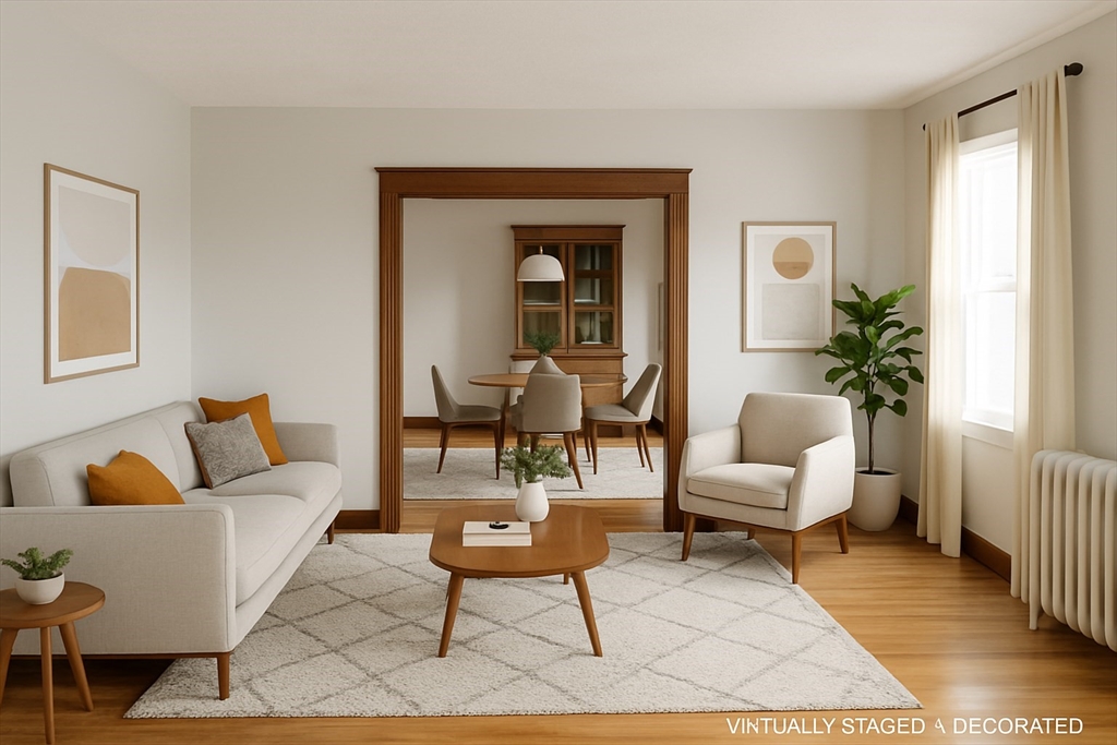 90 Boylston Street, Unit 1 Watertown, MA 02472 - Photo 1 of 16 a living room with furniture and a potted plant